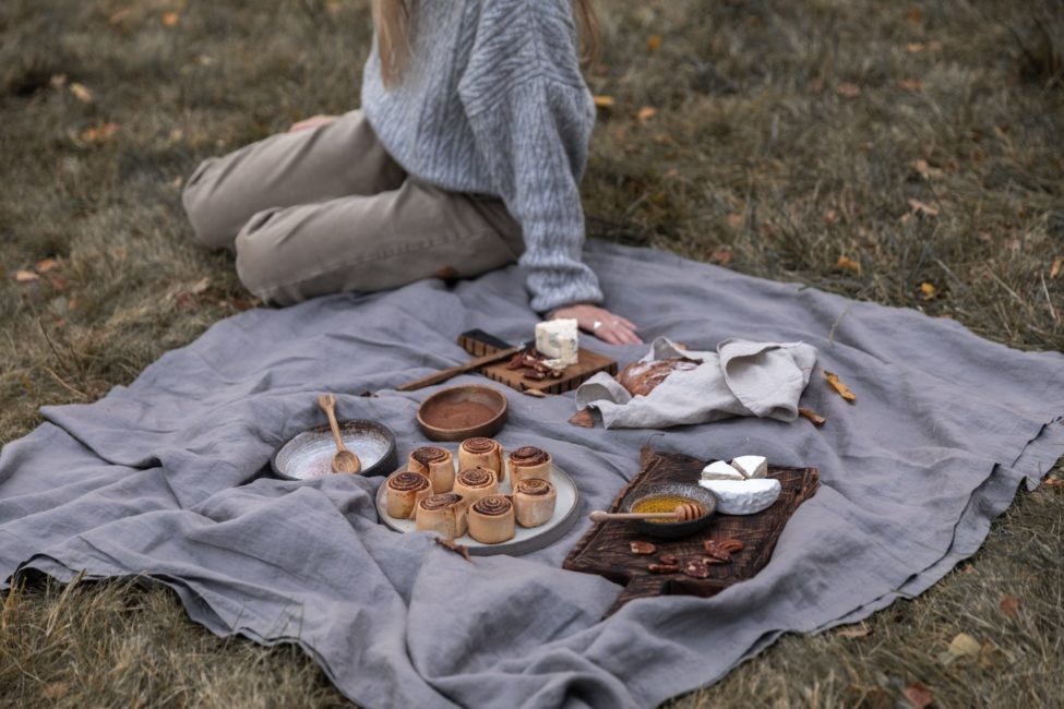 woman having picnic in autumn orange country beach house rental