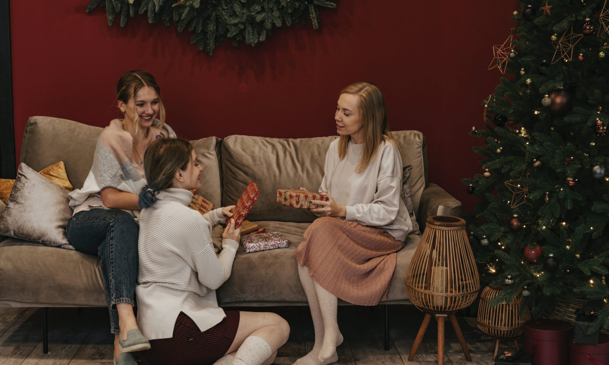 newport beach blog last minute holiday gift woman sitting on couch receiving gift