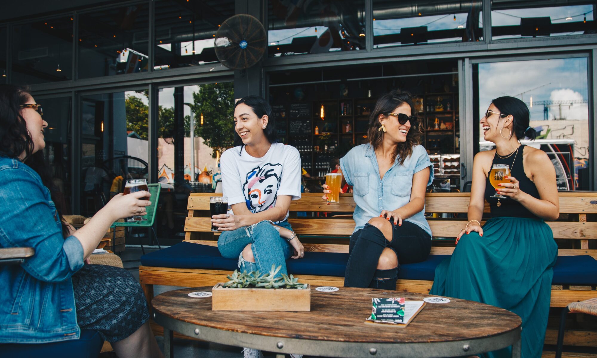 fiends sitting outside cafe newport beach getaway blog local food recommendations