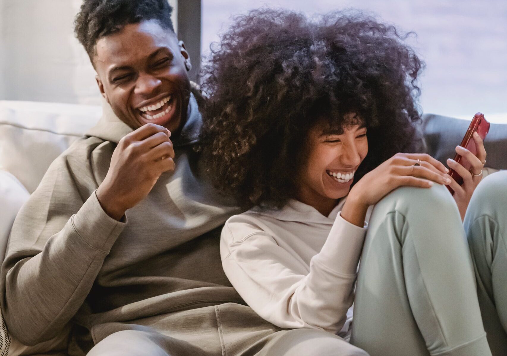 couple on couch newport beach vacation blog indoor date ideas