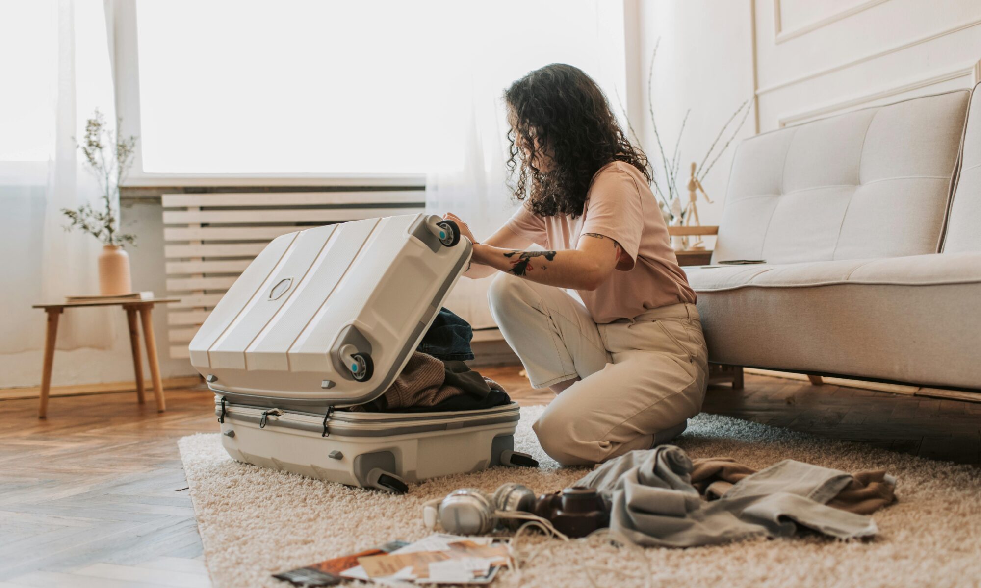 woman packing for fall vacation in newport beach